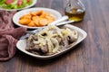 Fried liver on white dish and fried sweet potato on plate