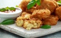 Fried Mac, macaroni and Cheese Bites in breadcrumbs with ketchup sauce on white wooden board Royalty Free Stock Photo