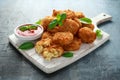 Fried Mac, macaroni and Cheese Bites in breadcrumbs with ketchup sauce on white wooden board Royalty Free Stock Photo