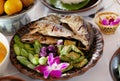 fried mackerel fish in blue dish. Shrimp paste sauce and vegetable set. Thai food. Fried mackerel with shrimp paste sauce and vege