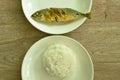 Fried mackerel fish fermenting turmeric powder eat couple plain rice on palte