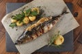 Fried mackerel fish stuffed with lemon. Royalty Free Stock Photo