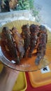 Fried mackerel on a plate in a restaurant, Indonesia. Crispy and tasty fried catfish