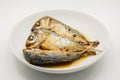 Fried mackerel on white plate. Deep fried fish