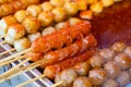 Fried meat balls a grill on a stick in sauce Royalty Free Stock Photo