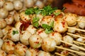 Fried meat balls a grill on a stick in sauce Royalty Free Stock Photo