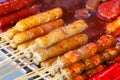 Fried meat balls a grill on a stick in sauce Royalty Free Stock Photo