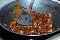 Fried meat in a frying pan closeup. Meat in a pan fry - making food Royalty Free Stock Photo