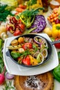 Fried meat on the frying pan with vegetables and baked potatoes with vegetables Royalty Free Stock Photo