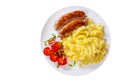 Fried meat sausages with mashed potatoes and vegetables salad in a plate. top view Royalty Free Stock Photo