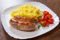 Fried meat sausages with mashed potatoes and vegetables salad Royalty Free Stock Photo