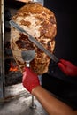 Fried meat on a skewer for cooking of donors or shawarma. Close-up Royalty Free Stock Photo