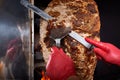 Fried meat on a skewer for cooking of donors or shawarma. Close-up Royalty Free Stock Photo