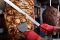 Fried meat on a skewer for cooking of donors or shawarma. Close-up Royalty Free Stock Photo