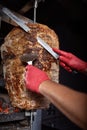 Fried meat on a skewer for cooking of donors or shawarma. Close-up Royalty Free Stock Photo