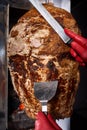 Fried meat on a skewer for cooking of donors or shawarma. Close-up Royalty Free Stock Photo