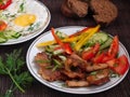 Fried meat with vegetables and eggs Royalty Free Stock Photo