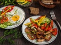 Fried meat with vegetables and eggs Royalty Free Stock Photo