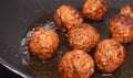 Fried meatball cooking in fat Royalty Free Stock Photo