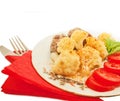 Fried meatballs with cauliflower and tomato on a nice plate Royalty Free Stock Photo