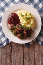 Fried meatballs, lingonberry sauce with potato garnish. Vertical Royalty Free Stock Photo