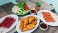 The fried meatballs made from a variety of meats and sausages, mixed with flour and seasonings with a delicious spicy sauce and Royalty Free Stock Photo