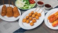 The fried meatballs made from a variety of meats and sausages, mixed with flour and seasonings with a delicious spicy sauce and Royalty Free Stock Photo