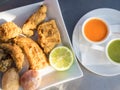 Fried moray eel with salt potato, accompanied by mojo picon and green mojo. Typical dish of the cuisine of the Canary Islands