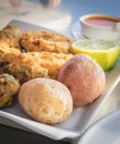 Fried moray eel with salt potato, accompanied by mojo picon and green mojo. Typical dish of the cuisine of the Canary Islands