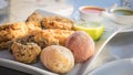 Fried moray eel with salt potato, accompanied by mojo picon and green mojo. Typical dish of the cuisine of the Canary Islands