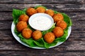 Fried mozzarella cheese stick balls with white sauce Royalty Free Stock Photo