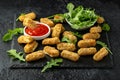 Fried mozzarella cheese sticks in breadcrumbs with ketchup sauce and wild rocket leaves Royalty Free Stock Photo