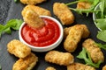 Fried mozzarella cheese sticks in breadcrumbs with ketchup sauce and wild rocket leaves Royalty Free Stock Photo