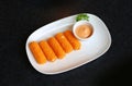 Fried mozzarella cheese sticks breaded in white plate Royalty Free Stock Photo