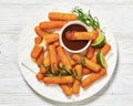 fried mozzarella sticks with sauce on white plate Royalty Free Stock Photo