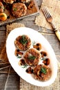 Fried mushroom burgers with onion and spices on a plate. Homemade mushroom cutlets. Top view Royalty Free Stock Photo