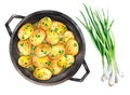 Fried new potatoes with onions in a frying pan