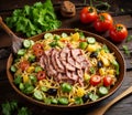 Fried noodle with ham and vegetables on a wooden background.