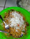 Fried noodles added with cheese, must be accompanied by rice when eating it