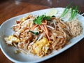 Fried noodles with omelette mixed together. Thai food Royalty Free Stock Photo