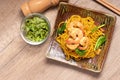 Fried noodles with shrimp in a plate on the table Royalty Free Stock Photo