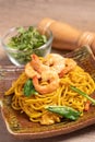 Fried noodles with shrimp in a plate on the table Royalty Free Stock Photo