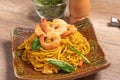 Fried noodles with shrimp in a plate on the table Royalty Free Stock Photo