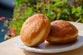 Fried in oil french stuffed with apples or chocolate beignets donuts pastry, sweet dessert served outdoor