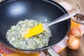 Fried onion in oil in a frying pan Royalty Free Stock Photo