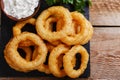 Fried onion rings in batter with sauce Royalty Free Stock Photo