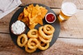 Fried onion rings in batter with sauce chips Royalty Free Stock Photo