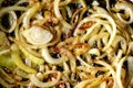 Fried onions in a frying pan. Roasting the chopped onion in oil. Royalty Free Stock Photo