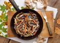 Fried oyster mushroom on a frying pan Royalty Free Stock Photo