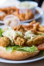 Fried Oyster Po-Boy Sandwich Topped with Cole Slaw Royalty Free Stock Photo